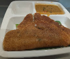 Ghee roast dosa served hot